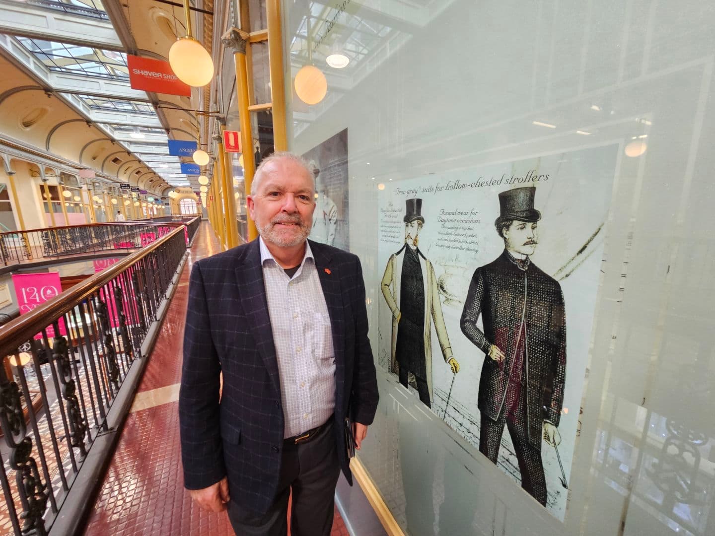 Colin Shearing beside a heritage display in Adelaide Arcade