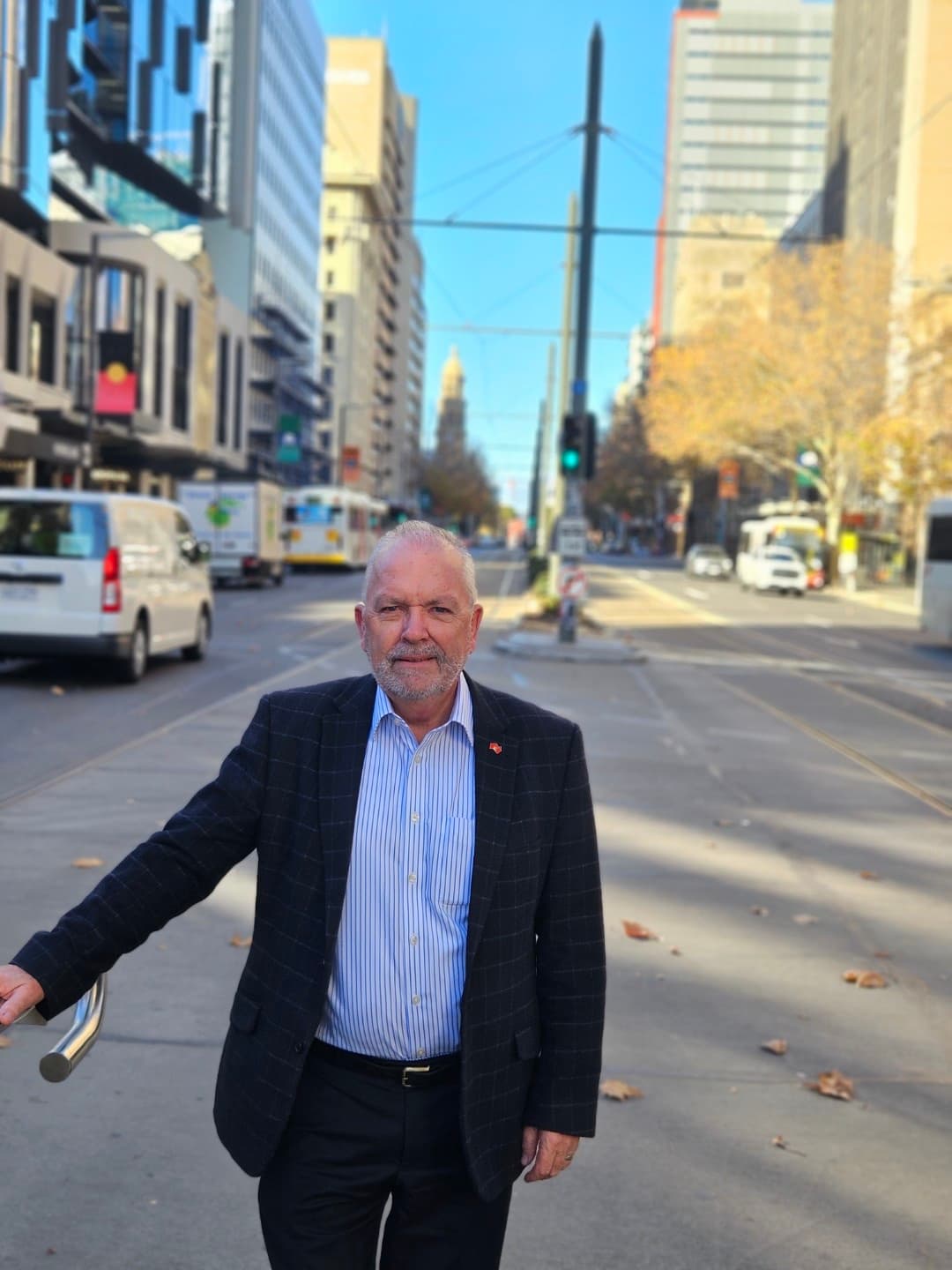 Colin Shearing on an Adelaide city street, looking toward the camera